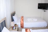 Postel nebo postele na pokoji v ubytování Locanda Pyramids Hotel