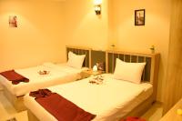 Postel nebo postele na pokoji v ubytování Locanda Pyramids Hotel