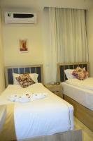 Postel nebo postele na pokoji v ubytování Locanda Pyramids Hotel