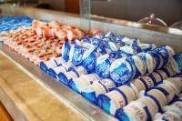 a display of blue and white cans of coke bottles at E-DA Royal Hotel in Dashu
