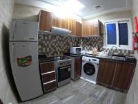 Barsha Star Residence - Home Stayにあるキッチンまたは簡易キッチン