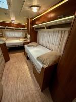 Posteľ alebo postele v izbe v ubytovaní PS-Caravaning auf Union Lido - Wohnwagenvermietung