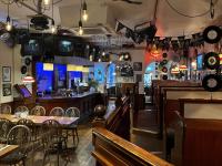 a restaurant with tables and chairs and a bar at The White Hart Hotel in Holsworthy
