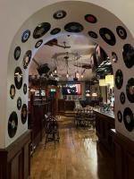a room with a bunch of records on the wall at The White Hart Hotel in Holsworthy