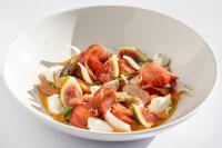 a white bowl filled with a fruit salad at Hotel Alahuar in Benimaurell