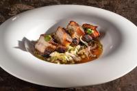 a white bowl of food with meat and rice at Hotel Alahuar in Benimaurell