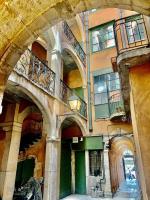 an old building with arches and balconies on it at Les 24 colonnes in Lyon