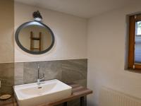 a bathroom with a sink and a mirror on the wall at Apartment Appartment Wiesberg by Interhome in Niedernsill