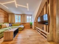 TV a/nebo společenská místnost v ubytování Apartment Máj-4 by Interhome