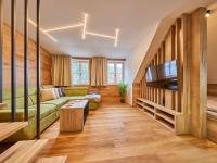 TV a/nebo společenská místnost v ubytování Apartment Máj-4 by Interhome