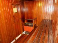 a wooden room with a tv in the wall at Sundeck Hotel in Perisher Valley