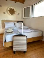 Postel nebo postele na pokoji v ubytování Del Sol Suites
