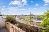 a balcony with a view of the city at Comfortable flat w views of Paris in Saint-Denis - Welkeys in Saint-Denis
