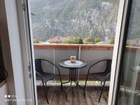 a table with chairs and a coffee cup on a balcony at groassehof Haus Gstrein in Imsterberg