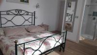 A bed or beds in a room at B&B Mimosa e Lillà