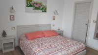A bed or beds in a room at B&B Mimosa e Lillà