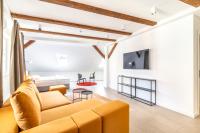Televízia a/alebo spoločenská miestnosť v ubytovaní Apartman Kaptol
