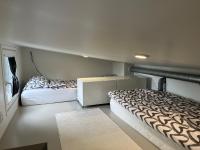 Luxus Tiny House Saagalaにあるベッド