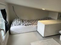 Luxus Tiny House Saagalaにあるベッド