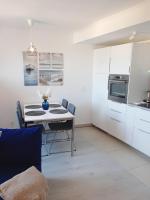 Kuchyňa alebo kuchynka v ubytovaní Sunshine Residence Deluxe Apartment