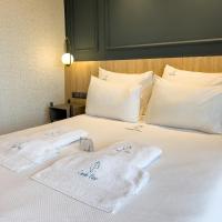 Postel nebo postele na pokoji v ubytování CUNDA PİER OTEL