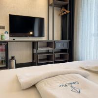 Postel nebo postele na pokoji v ubytování CUNDA PİER OTEL
