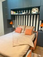 a bed with two pillows on it in a room at Studio Calme Batignolles in Paris