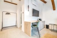 Televízia a/alebo spoločenská miestnosť v ubytovaní Apartman Kaptol