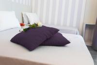 A bed or beds in a room at Hotel Star