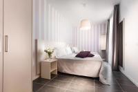 A bed or beds in a room at Hotel Star