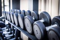 a row of dumbbells lined up in a gym at Best Western Premier Hotel Prince de Galles in Menton