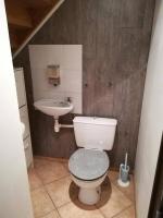 a bathroom with a toilet and a sink at Petit Paradis au calme en plein Marseille in Marseille