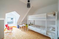 a bedroom with a bunk bed and a desk at Ar Mimoza - Appt pour 6 in Muzillac