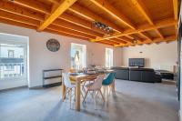 a dining room and living room with a table and chairs at Ar Mimoza - Appt pour 6 in Muzillac