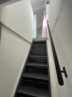 a staircase with a letter on the side of a building at Bienvenue au 6 - Calme et charme de la pierre. in Fourques