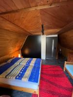 A bed or beds in a room at Chata na Liptove