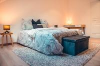 Een bed of bedden in een kamer bij Les temps heureux