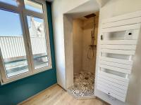 a bathroom with a walk in shower next to a window at Appartement Saint-Pair-sur-Mer, 3 pièces, 4 personnes - FR-1-361-506 in Saint-Pair-sur-Mer