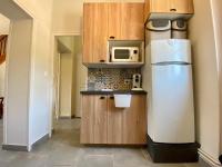 a kitchen with a refrigerator and a microwave at Le LOUIS 16 - Maison avec jardin in Valence