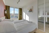 Łóżko lub łóżka w pokoju w obiekcie Grand Apartments Chlebova