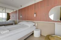 Łóżko lub łóżka w pokoju w obiekcie Grand Apartments Chlebova