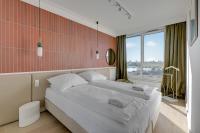 Łóżko lub łóżka w pokoju w obiekcie Grand Apartments Chlebova