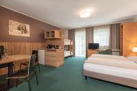 Postel nebo postele na pokoji v ubytování AlpenParks Hotel MONTANA