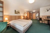 Postel nebo postele na pokoji v ubytování AlpenParks Hotel MONTANA