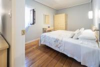 Cama o camas de una habitación en Apartamentos Santa Lucia