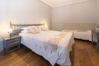 Cama o camas de una habitación en Apartamentos Santa Lucia
