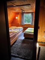 A bed or beds in a room at Chata na Liptove