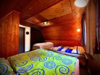 A bed or beds in a room at Chata na Liptove