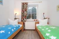 Postel nebo postele na pokoji v ubytování Haus Jenny Wohnung H 4a