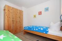 Postel nebo postele na pokoji v ubytování Haus Jenny Wohnung H 4a
